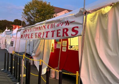 A food truck with a sign that says apple ritters, offering delicious apple fritters as a tasty treat.